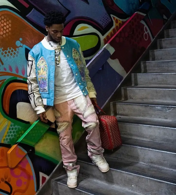 Key Glock outfit in Who Decides War, Nike, and Goyard, 2023