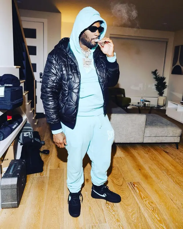 Peezy outfit in Louis Vuitton, Goyard, and Versace, 2023