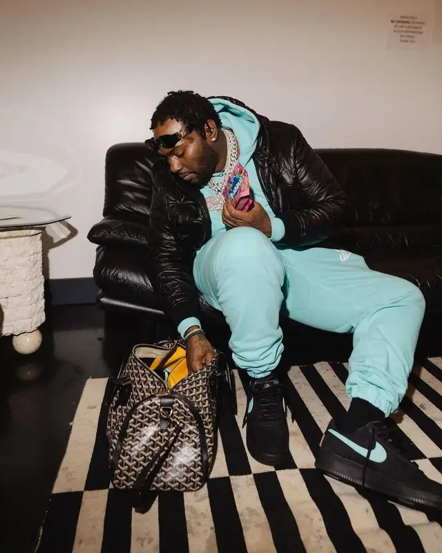 Peezy outfit in Louis Vuitton, Goyard, and Versace, 2023