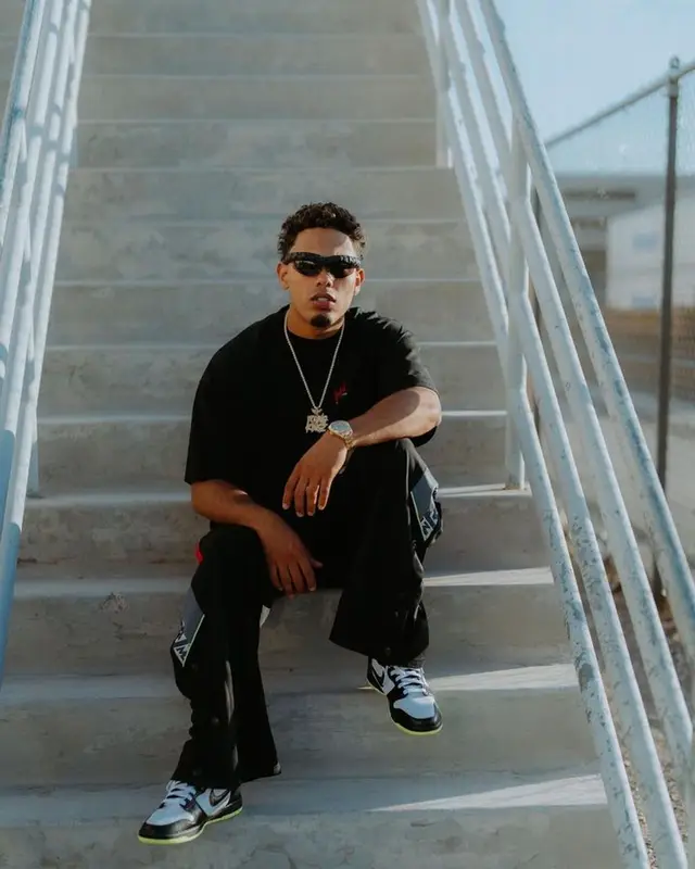Myke Towers outfit in Martine Rose, Nike, and Bottega Veneta, 2023