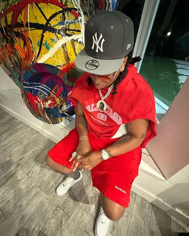 Lil Gotit outfit in Balenciaga, Cartier, and New Era, 2023