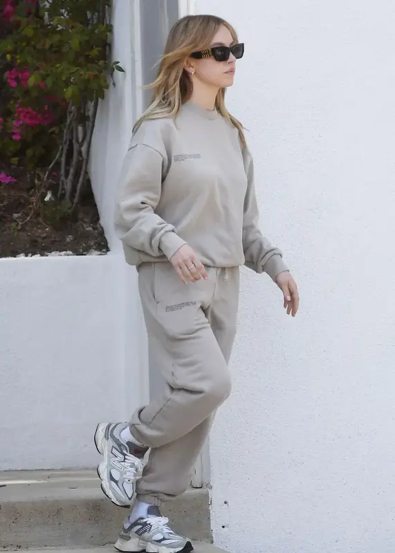 Sydney Sweeney outfit in Pangaia, New Balance, and Miu Miu, 2023