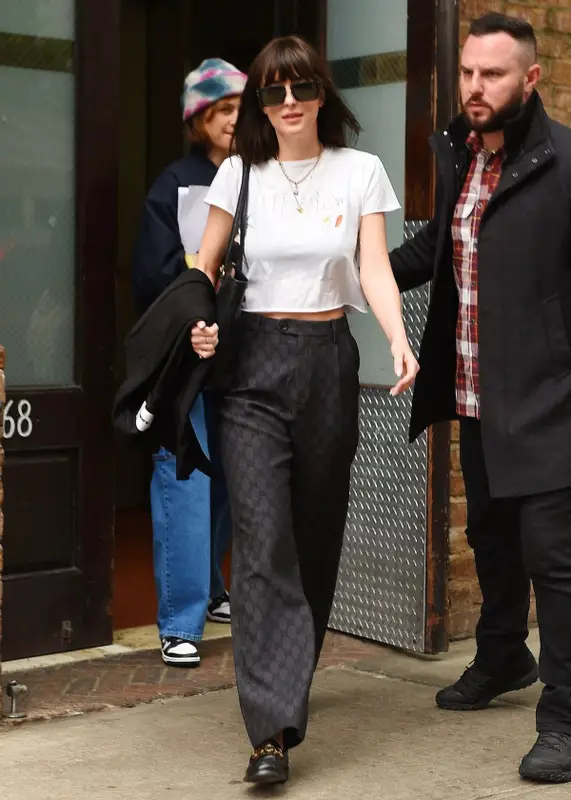 Dakota Johnson outfit in Jil Sander, The Row, and Jacquemus, 2023