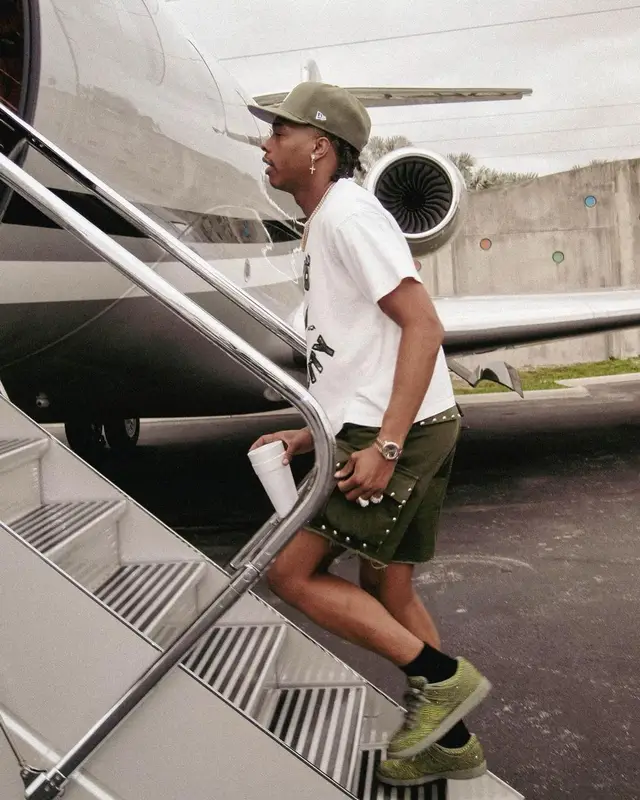 Lil Baby outfit in Celine, Nike, and New Era, 2023