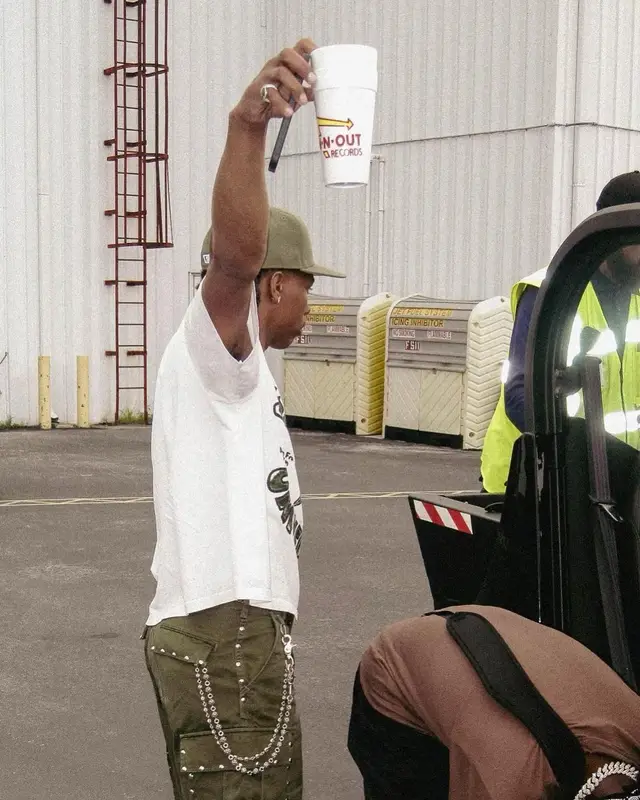 Lil Baby outfit in Celine, Nike, and New Era, 2023