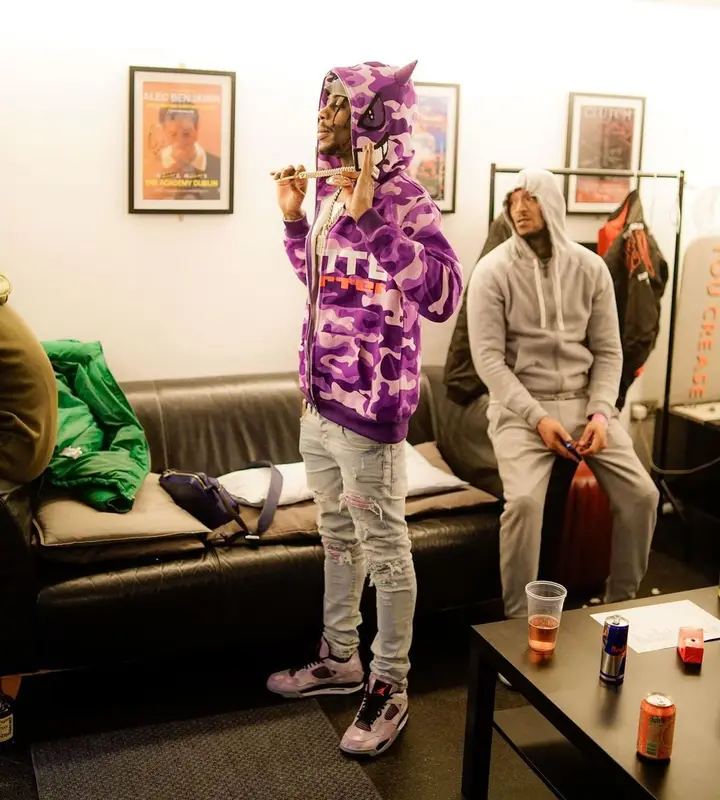 Russ Millions outfit in Amiri, Jordan, and Louis Vuitton, 2023