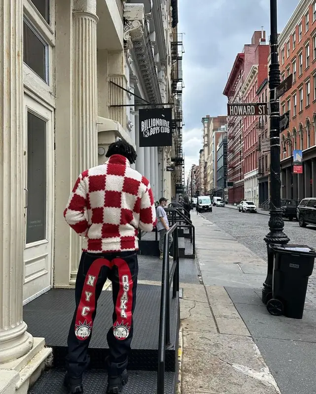 Jules Kounde outfit in Louis Vuitton, Prada, and Nigo, 2023