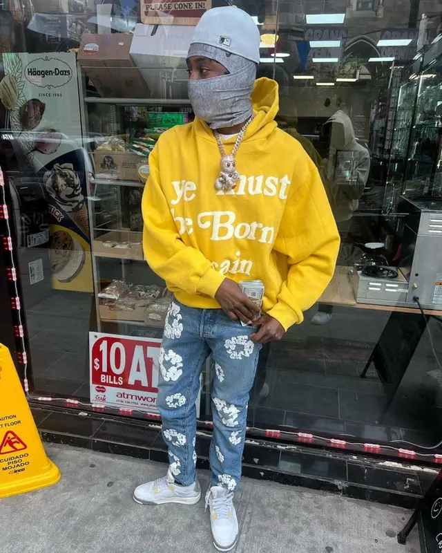 Lil Tjay outfit in Cactus Plant Flea Market, Levi’s, and Nike, 2023