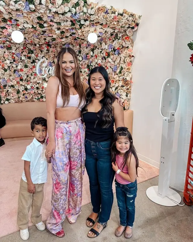 Chrissy Teigen outfit in Hanro, Dries Van Noten, and Aquazzura, 2023