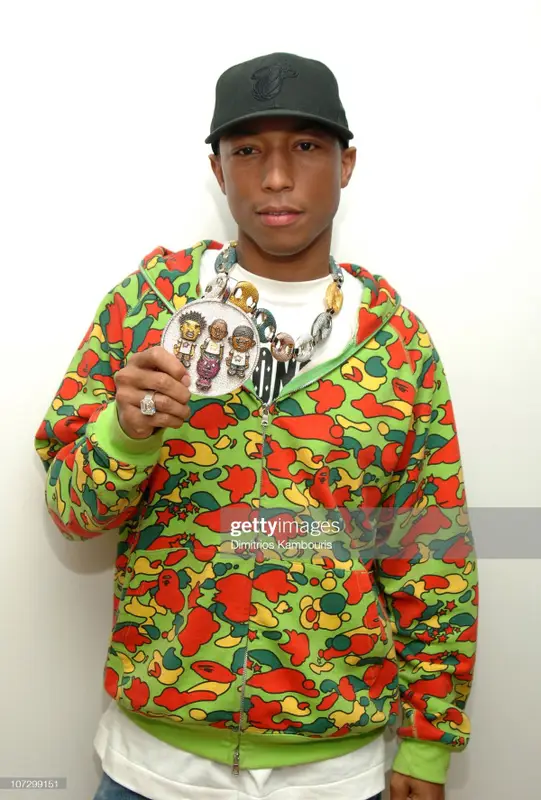Pharrell Williams outfit in Bape, Jacob & Co., and New Era, 2005