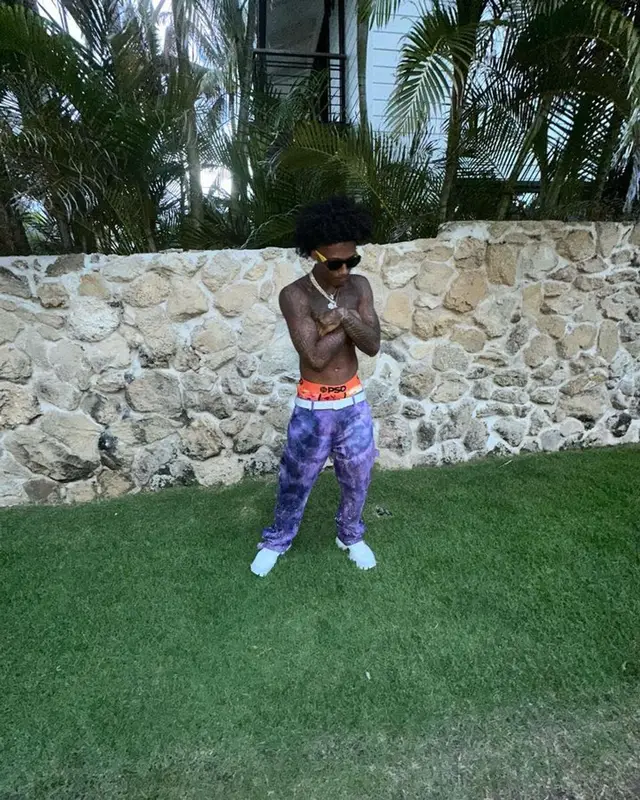 Mikey outfit in Amiri, Prada, and Louis Vuitton, 2023