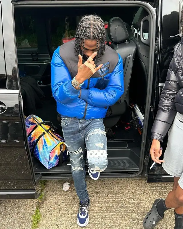 Russ Millions outfit in Louis Vuitton, Amiri, and Dior, 2023