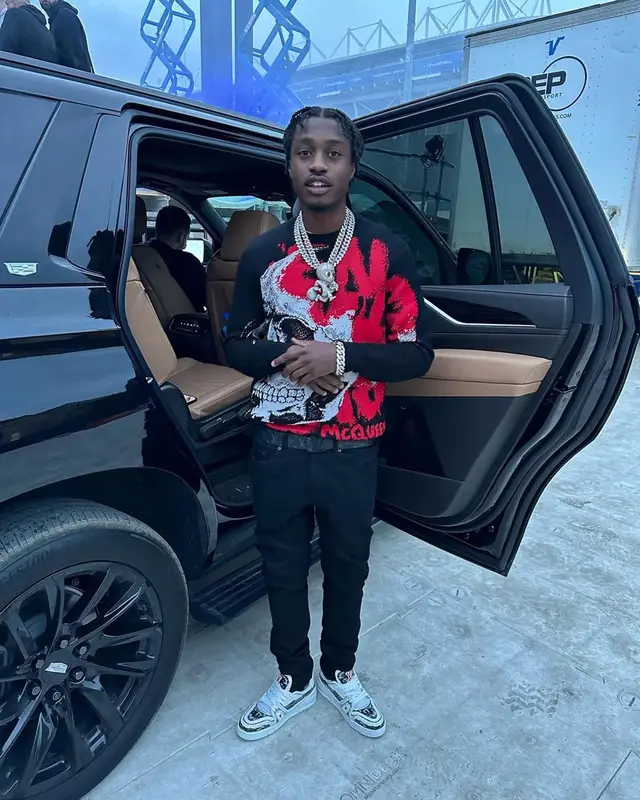 Lil Tjay outfit in Alexander McQueen, Amiri, and Louis Vuitton, 2023