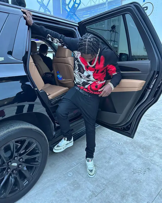 Lil Tjay outfit in Alexander McQueen, Amiri, and Louis Vuitton, 2023