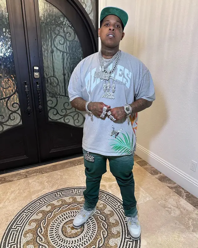 Finesse2tymes outfit in Paper Planes, Purple Brand, and Jordan, 2023