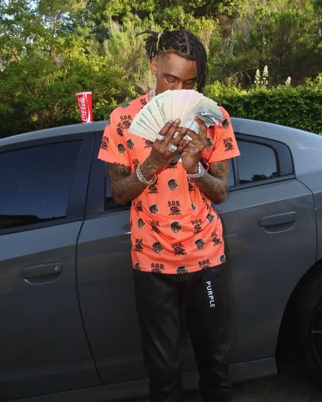 Soulja Boy outfit in Soulja Boy Merch, Purple Brand, and Dior, 2023