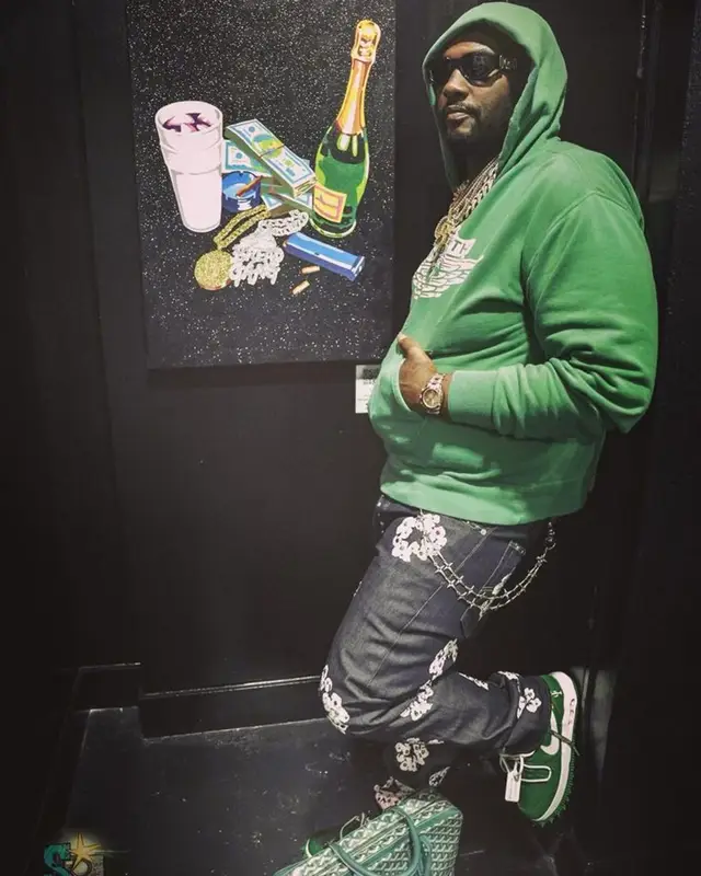 Peezy outfit in Levi’s, Goyard, and Versace, 2023