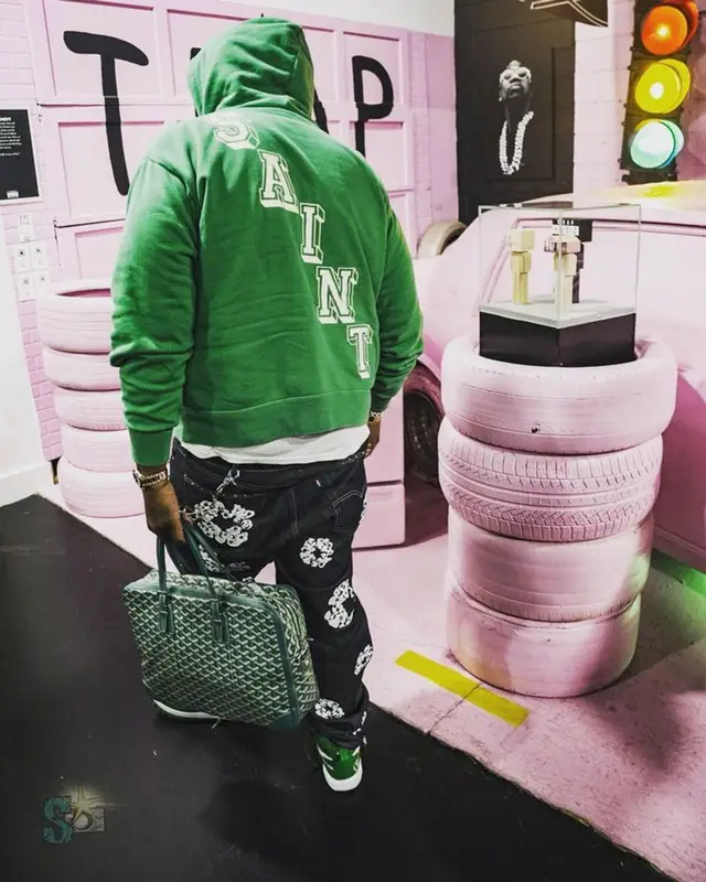 Peezy outfit in Levi’s, Goyard, and Versace, 2023
