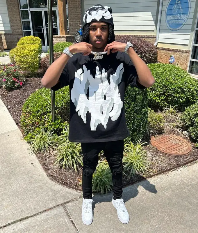 Lil Darius outfit in Amiri, Nike, and Noxinus, 2023