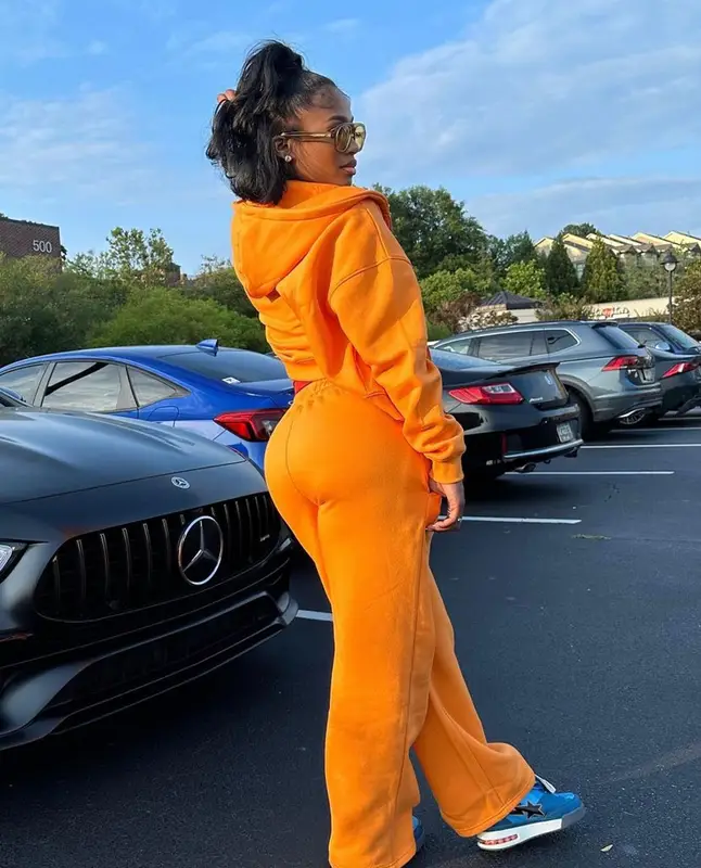 Dess Dior outfit in BooHoo, A Bathing Ape, and Chanel, 2023