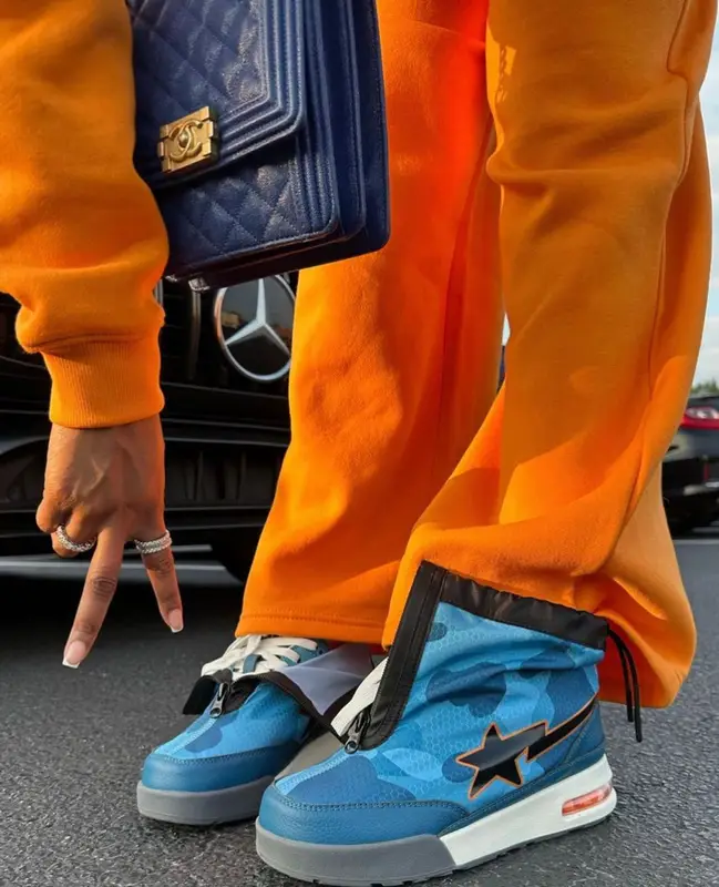 Dess Dior outfit in BooHoo, A Bathing Ape, and Chanel, 2023