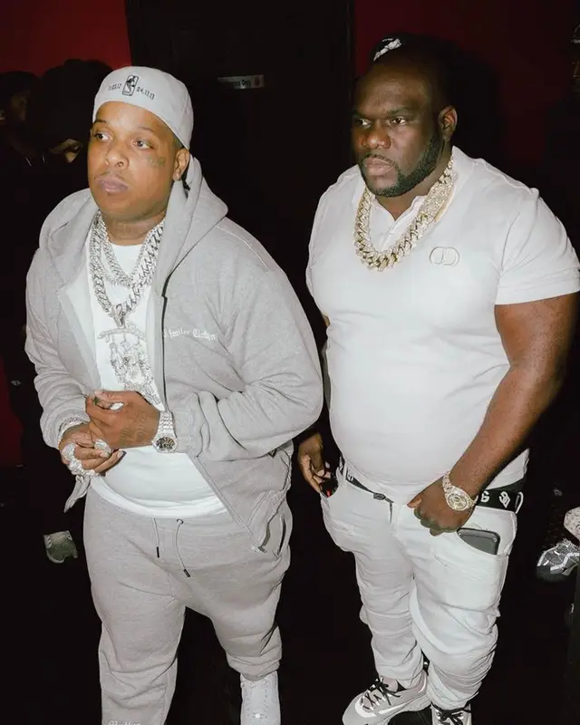 Finesse2tymes outfit in All Smillez Clothing, Nike, and New Era, 2023