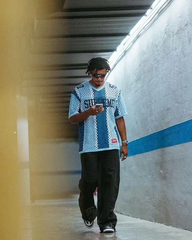 Jules Kounde outfit in Supreme, Paradoxe Paris, and Oakley, 2023