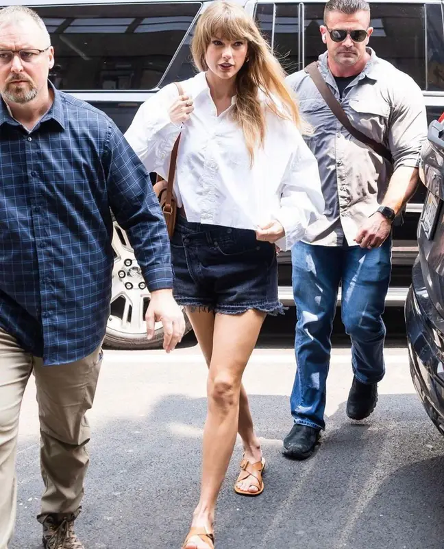 Taylor Swift outfit in R13, Ralph Lauren, and Andre Emery, 2023