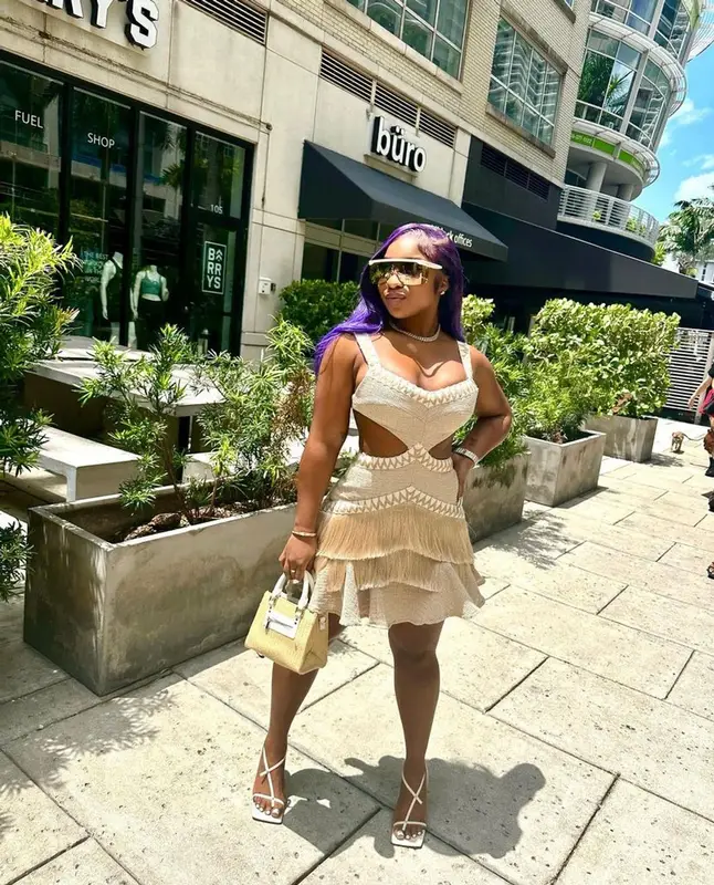 Reginae Carter outfit in Target, Dior, and Bottega Veneta, 2023