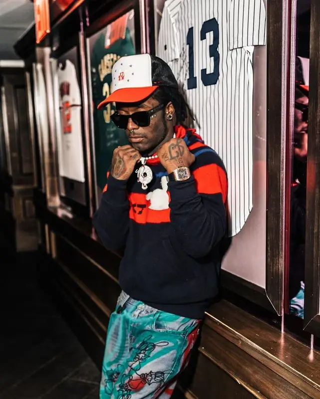 Lil Uzi Vert outfit in Nike, Ferragamo, and Skoloct, 2023