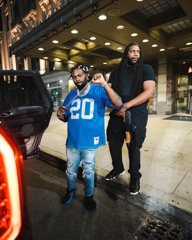 Peezy outfit in Mitchell & Ness, Amiri, and Versace, 2023