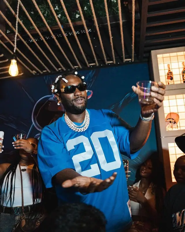Peezy outfit in Mitchell & Ness, Amiri, and Versace, 2023