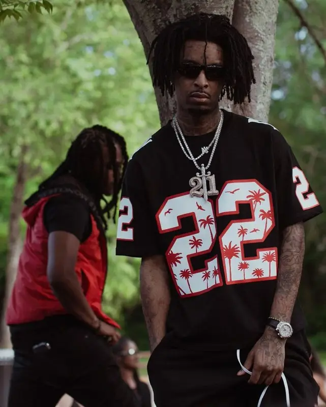 21 Savage outfit in Amiri, Nike, and Prada, 2023
