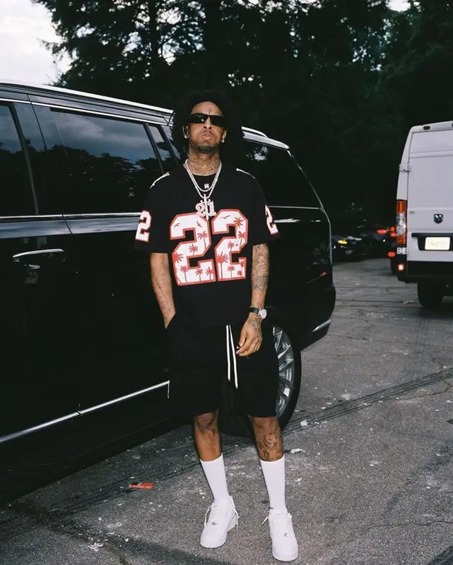 21 Savage outfit in Amiri, Nike, and Prada, 2023