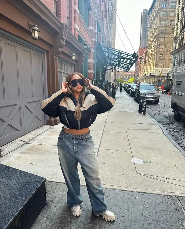 Jordyn Woods outfit in Mugler, Prada, and Gucci, 2023