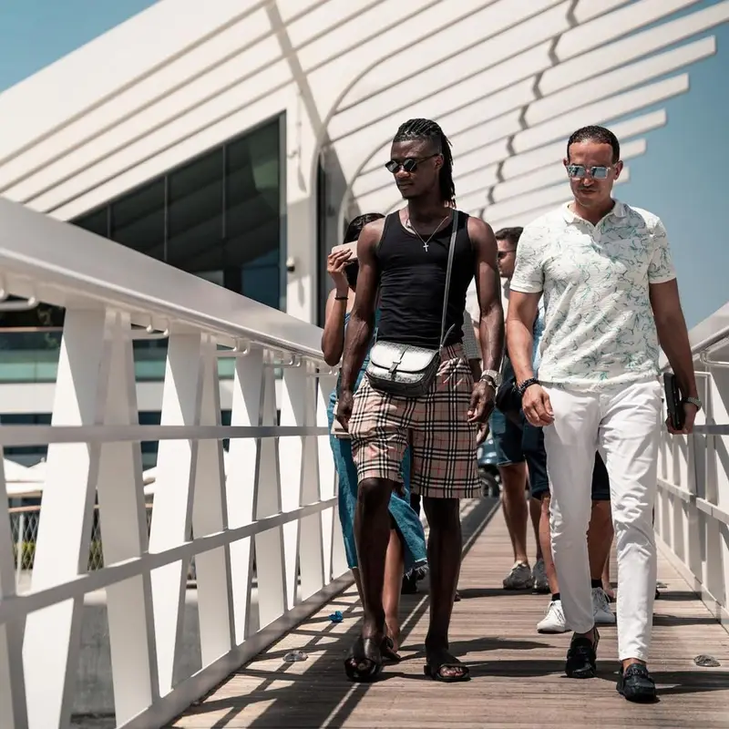 Eduardo Camavinga outfit in Burberry, Goyard, and Louis Vuitton, 2023