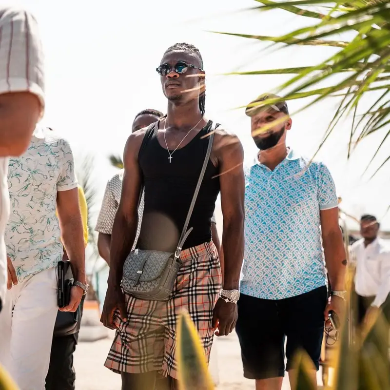 Eduardo Camavinga outfit in Burberry, Goyard, and Louis Vuitton, 2023