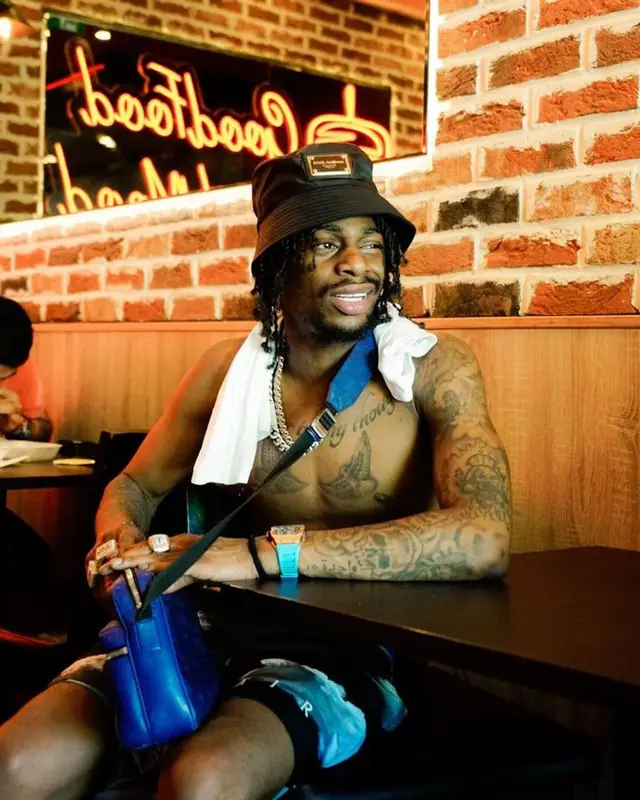 Russ Millions outfit in Jordan, Louis Vuitton, and Dolce & Gabbana, 2023