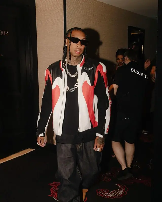 Tyga outfit in Palace, Prada, and Evisu, 2023