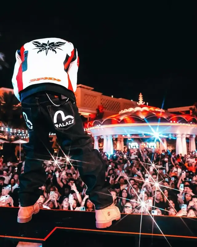 Tyga outfit in Palace, Prada, and Evisu, 2023