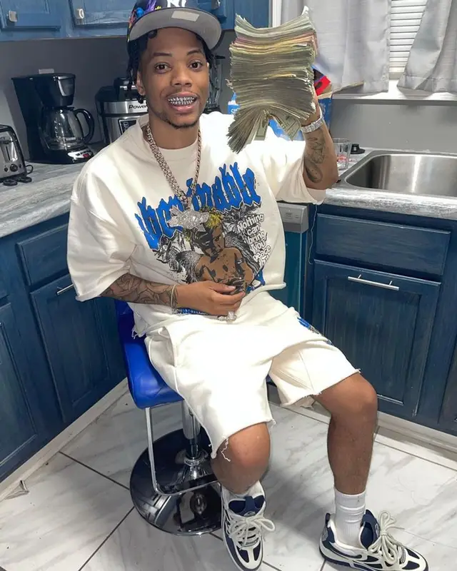 Lil Migo outfit in Luv Abominable, Louis Vuitton, and New Era, 2023