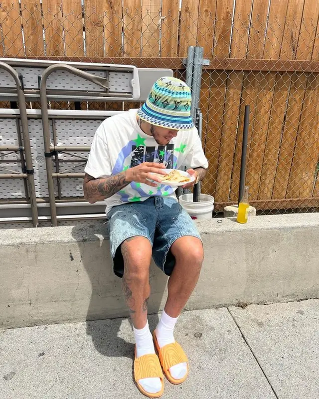 Kyle Kuzma outfit in Saint Michael, Louis Vuitton, and Crocs, 2023