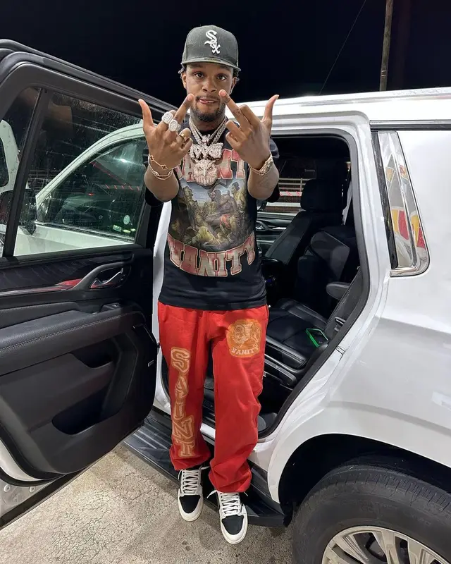 Toosii outfit in Jordan, New Era, and Travis Scott Merch, 2023