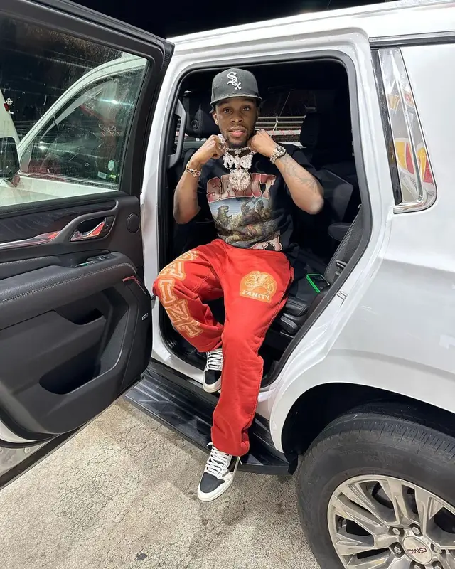 Toosii outfit in Jordan, New Era, and Travis Scott Merch, 2023