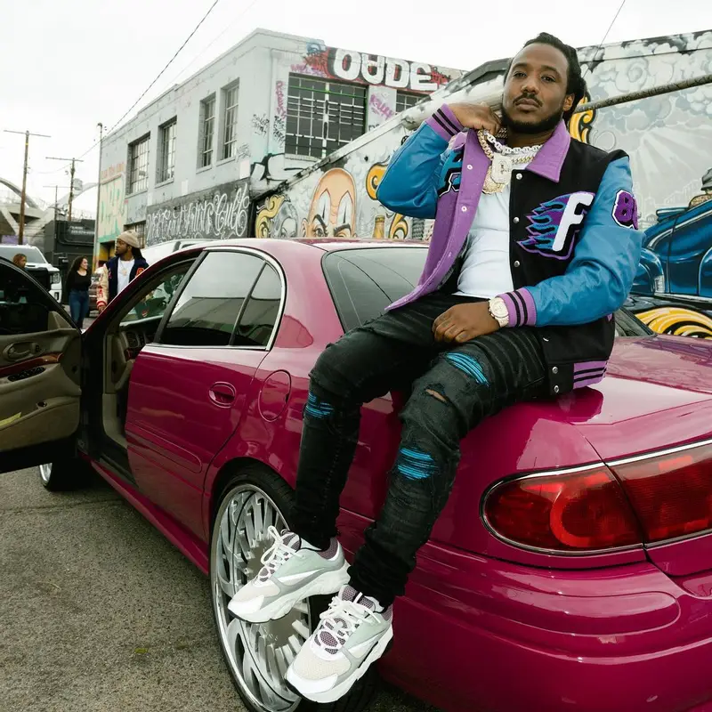 Mozzy outfit in Homme + Femme, Amiri, and Dior, 2023