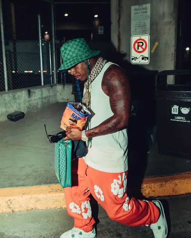 DaBaby outfit in Denim Tears, Goyard, and Gucci, 2023