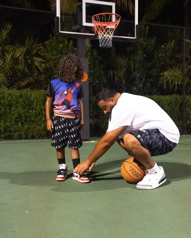 DJ Khaled outfit in Polo Ralph Lauren, Bape, and Mitchell & Ness, 2023