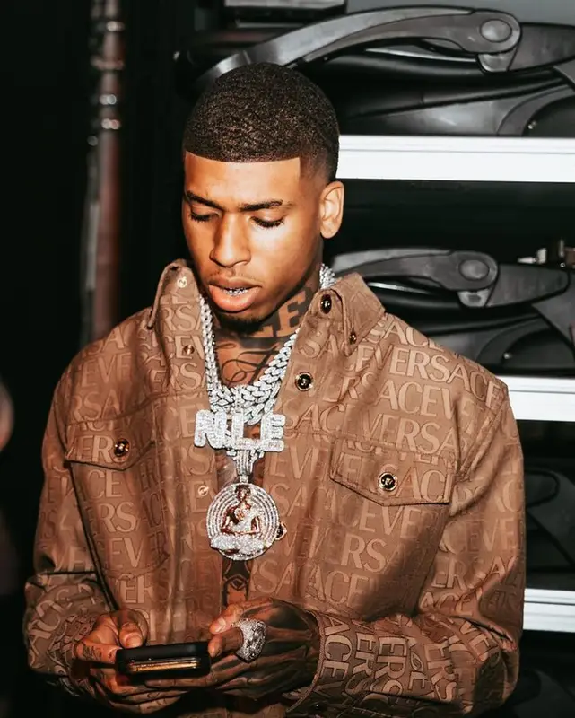 NLE Choppa outfit in Versace and Nike, 2023
