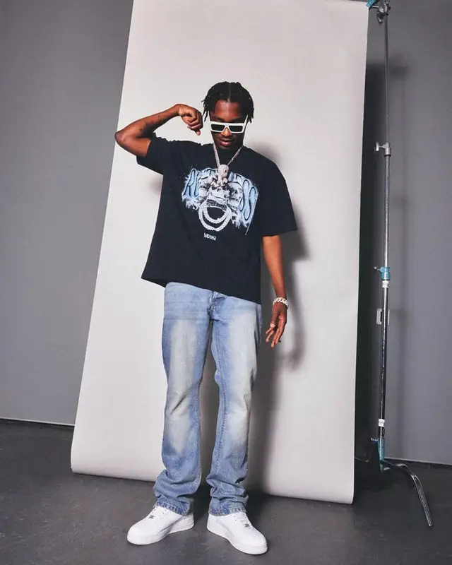 Lil Tjay outfit in BooHooMan, Supreme, and Celine, 2023