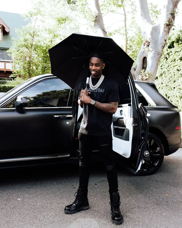 Polo G outfit in Louis Vuitton and Amiri, 2023